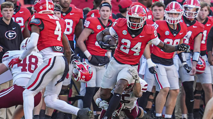 Nov 23, 2024; Athens, Georgia, USA; Georgia Bulldogs defensive back Malaki Starks (24) returns a punt against the Massachusetts Minutemen during the second half at Sanford Stadium. Mandatory Credit: Dale Zanine-Imagn Images