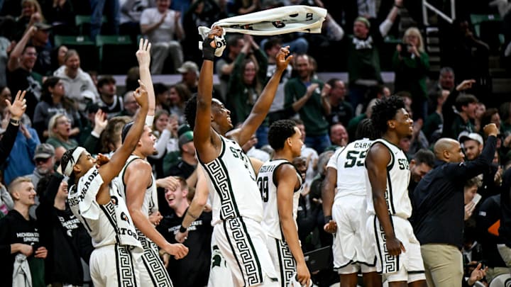 Michigan State's Cam Ward, center, and the rest of the team celebrate after the Walton's back-to-back 3-pointers against Toledo during the second half on Tuesday, Dec. 16, 2025, at the Breslin Center in East Lansing.