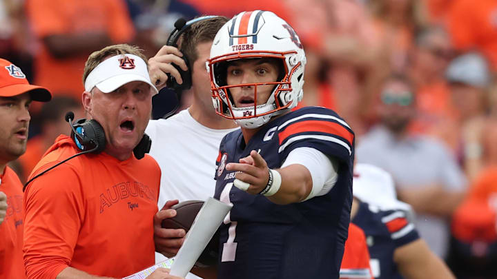 Sep 28, 2024; Auburn, Alabama, USA;  Auburn Tigers head coach Hugh Freeze talks with quarterback Payton Thorne (1) during the fourth quarter against the Oklahoma Sooners at Jordan-Hare Stadium. Mandatory Credit: John Reed-Imagn Images