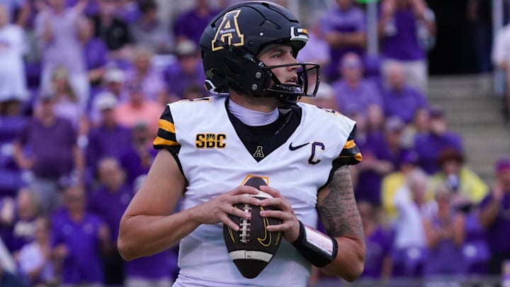 Sep 14, 2024; Greenville, North Carolina, USA;  Appalachian State Mountaineers quarterback Joey Aguilar (4) drops back to pass against the East Carolina Pirates during the first half at Dowdy-Ficklen Stadium. Mandatory Credit: James Guillory-Imagn Images