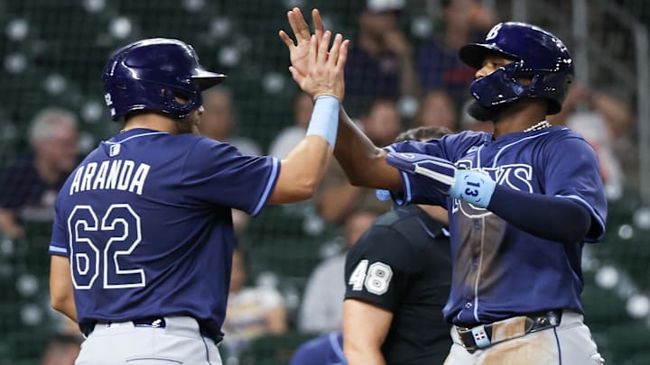 May 29, 2025; Houston, Texas, USA;  Tampa Bay Rays first baseman Jonathan Aranda (62) celebrates third baseman Junior Caminero (13) run against the Houston Astros in the eighth inning at Daikin Park.