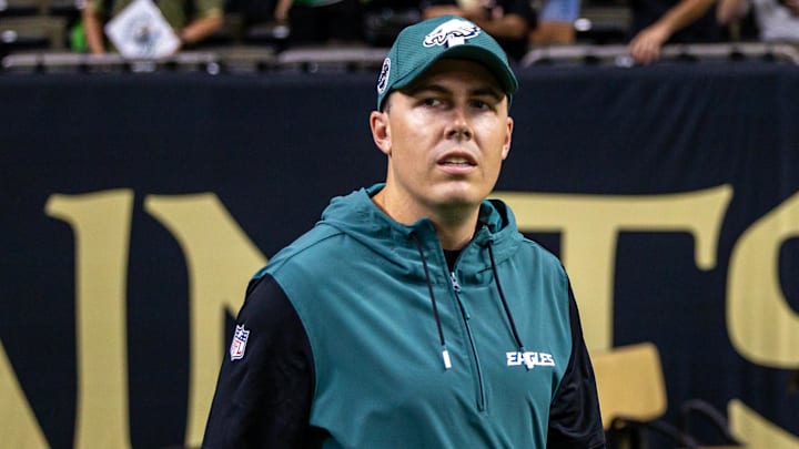 Sep 22, 2024; New Orleans, Louisiana, USA; Philadelphia Eagles offensive coordinator Kellen Moore looks on during warmups before the game against the New Orleans Saints at Caesars Superdome. Mandatory Credit: Stephen Lew-Imagn Images