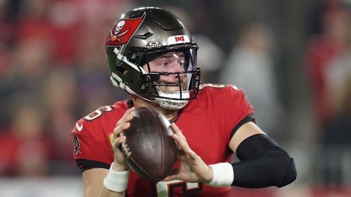 Jan 12, 2025; Tampa, Florida, USA; Tampa Bay Buccaneers quarterback Baker Mayfield (6) rolls out during the first quarter of a NFC wild card playoff against the Washington Commanders at Raymond James Stadium. Mandatory Credit: Nathan Ray Seebeck-Imagn Images