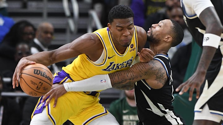 Mar 26, 2024; Milwaukee, Wisconsin, USA; Los Angeles Lakers forward Rui Hachimura (28) drives to the basket against Milwaukee Bucks guard Damian Lillard (0) in the first half at Fiserv Forum. Mandatory Credit: Michael McLoone-Imagn Images