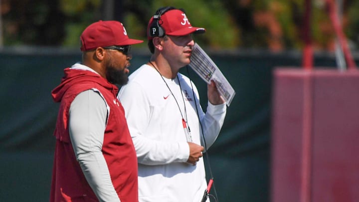 The Crimson Tide players and coaches work during practice Tuesday, Aug. 6, 2024. Alabama running backs coach Robert Gillespie talks to Alabama offensive coordinator Nick Sheridan as they watch an offensive drill.
