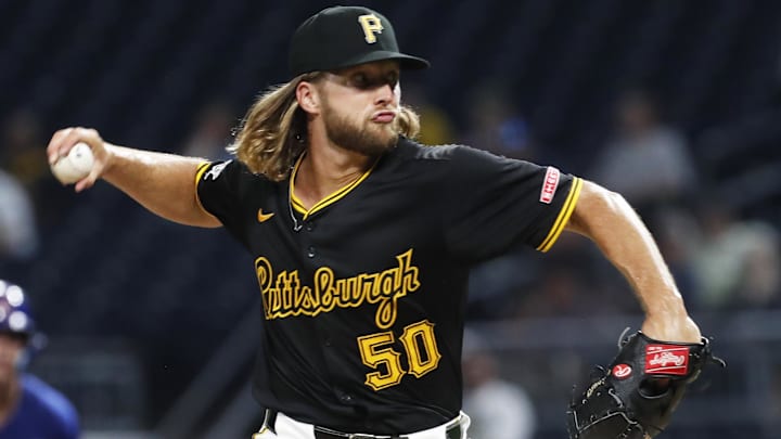 Aug 27, 2024; Pittsburgh, Pennsylvania, USA;  Pittsburgh Pirates relief pitcher Carmen Mlodzinski (50) pitches against the Chicago Cubs during the seventh inning at PNC Park. Chicago won 9-5. Mandatory Credit: Charles LeClaire-Imagn Images