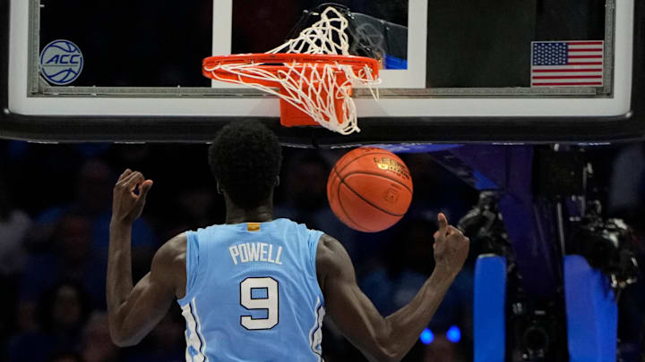 Mar 14, 2025; Charlotte, NC, USA; North Carolina Tar Heels guard Drake Powell (9) scores in the first half at Spectrum Center.