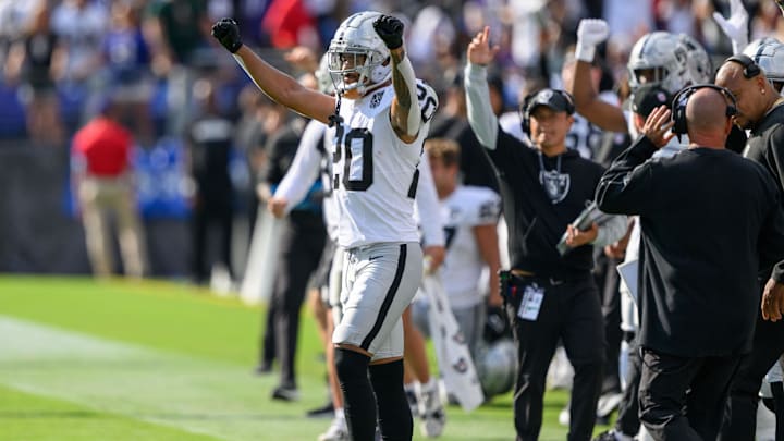 Sep 15, 2024; Baltimore, Maryland, USA; Las Vegas Raiders safety Isaiah Pola-Mao (20) celebrates from the sideline after a field goal kick during the second half against the Baltimore Ravens at M&T Bank Stadium. Mandatory Credit: Reggie Hildred-Imagn Images