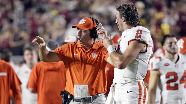 Oct 5, 2024; Tallahassee, Florida, USA; Clemson Tigers head coach Dabo Swinney talks with quarterback Cade Klubnik (2) during the first half against the Florida State Seminoles at Doak S. Campbell Stadium. Oct 5, 2024; Tallahassee, Florida, USA; Clemson Tigers head coach Dabo Swinney talks with quarterback Cade Klubnik (2) during the first half against the Florida State Seminoles at Doak S. Campbell Stadium.