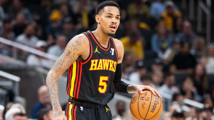 Apr 14, 2024; Indianapolis, Indiana, USA; Atlanta Hawks guard Dejounte Murray (5) dribbles the ball while Indiana Pacers guard Ben Sheppard (26) defends in the second half at Gainbridge Fieldhouse Apr 14, 2024; Indianapolis, Indiana, USA; Atlanta Hawks guard Dejounte Murray (5) dribbles the ball while Indiana Pacers guard Ben Sheppard (26) defends in the second half at Gainbridge Fieldhouse