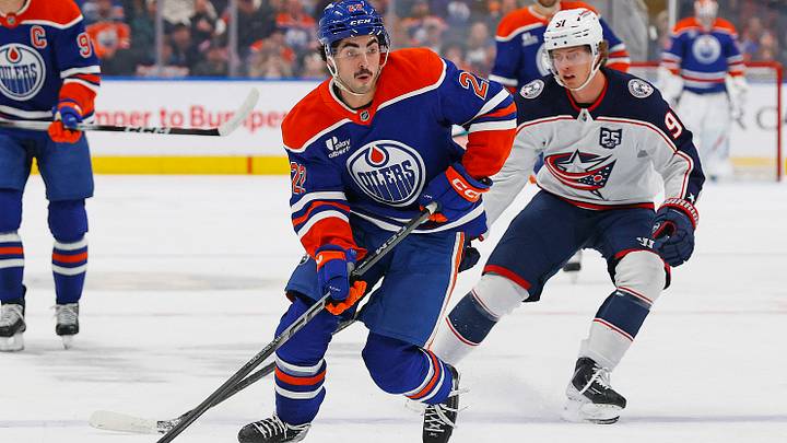 Nov 10, 2025; Edmonton, Alberta, CAN; Edmonton Oilers forward Matt Savoie (22) looks to make a pass in front of Columbus Blue Jackets forward Kent Johnson (91) during the first period at Rogers Place. Mandatory Credit: Perry Nelson-Imagn Images