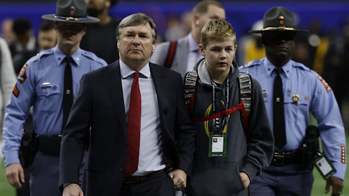Jan 2, 2025; New Orleans, LA, USA; Georgia Bulldogs head coach Kirby Smart (L) walks onto the field during Bulldogs team arrival prior to their game against the Notre Dame Fighting Irish in the Allstate Sugar Bowl at Caesars Superdome.  