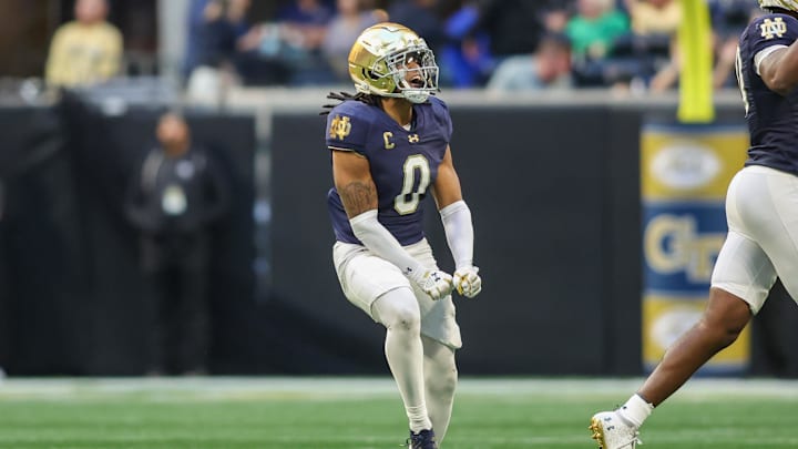 Oct 19, 2024; Atlanta, Georgia, USA; Notre Dame Fighting Irish safety Xavier Watts (0) celebrates after an interception against the Georgia Tech Yellow Jackets in the fourth quarter at Mercedes-Benz Stadium. Mandatory Credit: Brett Davis-Imagn Images
Oct 19, 2024; Atlanta, Georgia, USA; Notre Dame Fighting Irish safety Xavier Watts (0) celebrates after an interception against the Georgia Tech Yellow Jackets in the fourth quarter at Mercedes-Benz Stadium. Mandatory Credit: Brett Davis-Imagn Images