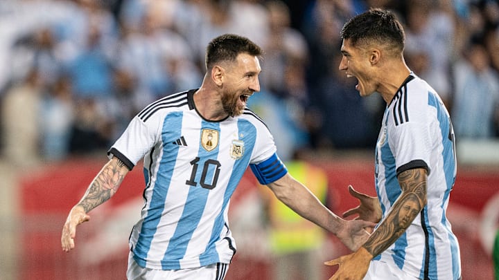 Lionel Messi (10) of Argentina celebrates with Carlos...
