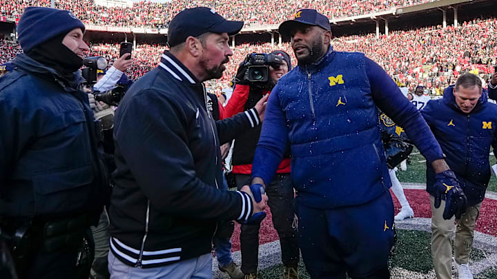 Ohio State Buckeyes head coach Ryan Day shakes hands with Michigan Wolverines head coach Sherrone Moore