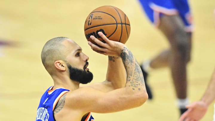 Oct 30, 2022; Cleveland, Ohio, USA; New York Knicks guard Evan Fournier (13) shoots in the first quarter against the Cleveland Cavaliers at Rocket Mortgage FieldHouse. Mandatory Credit: David Richard-Imagn Images