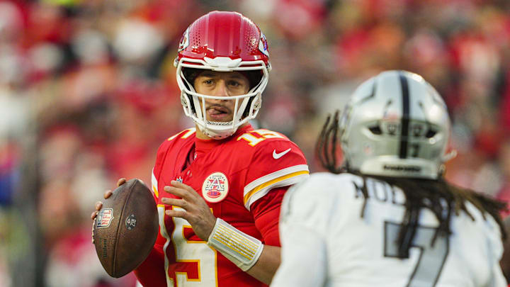 Nov 29, 2024; Kansas City, Missouri, USA; Kansas City Chiefs quarterback Patrick Mahomes (15) drops back to pass during the second half against the Las Vegas Raiders at GEHA Field at Arrowhead Stadium. Mandatory Credit: Jay Biggerstaff-Imagn Images