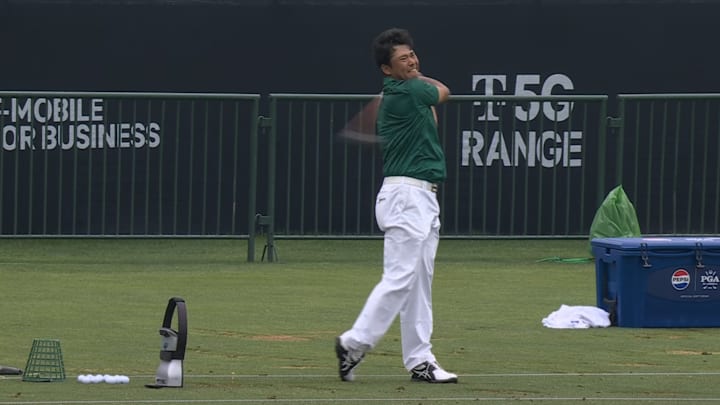 Hideki Matsuyama hits balls at the driving range at the PGA Championship.