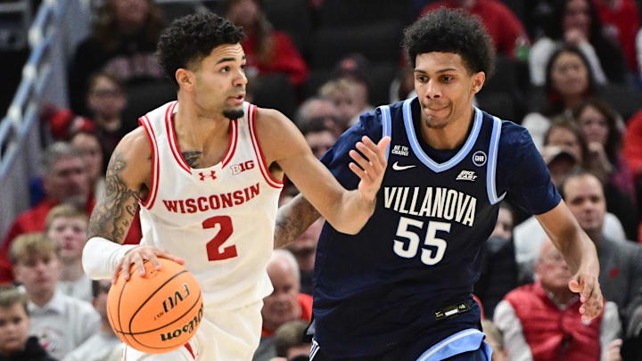 Dec 19, 2025; Milwaukee, Wisconsin, USA; Wisconsin Badgers guard Nick Boyd (2) drives for the basket against Villanova Wildcats guard Acaden Lewis (55) in the second half at the Fiserv Forum.