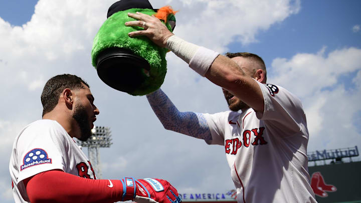 Aug 17, 2025; Boston, Massachusetts, USA; Boston Red Sox right fielder Wilyer Abreu (52) is greeted with a Wally the Green Monster helmet after hitting a two run home run during the fourth inning against the Miami Marlins at Fenway Park. Mandatory Credit: Bob DeChiara-Imagn Images