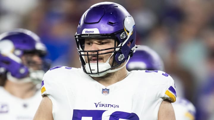 Jan 13, 2025; Glendale, AZ, USA; Minnesota Vikings center Garrett Bradbury (56) against the Los Angeles Rams during an NFC wild card game at State Farm Stadium. Mandatory Credit: Mark J. Rebilas-Imagn Images