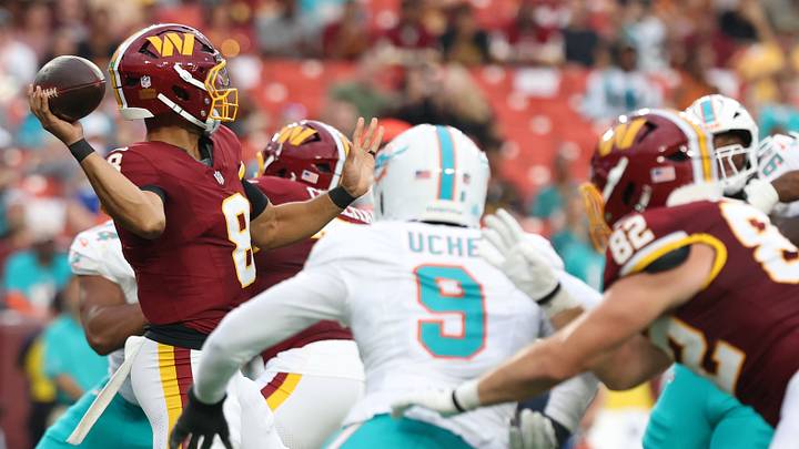 Aug 14, 2026; Landover, Maryland, USA; Washington Commanders quarterback Marcus Mariota (8) passes the ball under pressure from Miami Dolphins linebacker Josh Uche (9) during the first half at Northwest Stadium. Mandatory Credit: Geoff Burke-Imagn Images Aug 14, 2026; Landover, Maryland, USA; Washington Commanders quarterback Marcus Mariota (8) passes the ball under pressure from Miami Dolphins linebacker Josh Uche (9) during the first half at Northwest Stadium. Mandatory Credit: Geoff Burke-Imagn Images