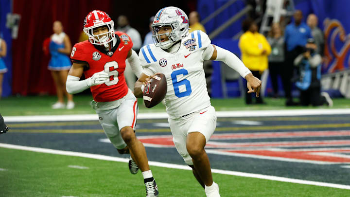 Jan 1, 2026; New Orleans, LA, USA; Mississippi Rebels quarterback Trinidad Chambliss (6) scrambles with the ball under pressure from Georgia Bulldogs defensive back Daylen Everette (6) in the fourth quarter during the 2025 Sugar Bowl and quarterfinal game of the College Football Playoff at Caesars Superdome. Mandatory Credit: Geoff Burke-Imagn Images