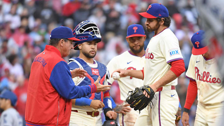 Apr 6, 2025; Philadelphia, Pennsylvania, USA; Philadelphia Phillies pitcher Jordan Romano (68) hands the ball to  manager Rob Thomson (59) after being removed from the game during the seventh inning against the Los Angeles Dodgers at Citizens Bank Park.