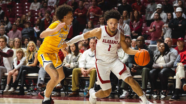 Dec 22, 2024; Tuscaloosa, Alabama, USA; Alabama Crimson Tide guard Mark Sears (1) works against Kent State Golden Flashes guard Jalen Sullinger (13) during the first half at Coleman Coliseum. Mandatory Credit: Will McLelland-Imagn Images