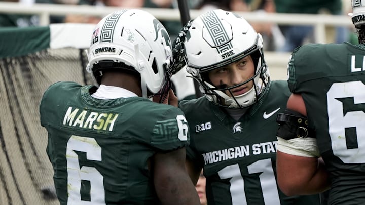 Oct 11, 2025; East Lansing, Michigan, USA; Michigan State wide receiver Nick Marsh (6) celebrates a touchdown against the UCLA Bruins with quarterback Alessio Milivojevic (11) in the fourth quarter at Spartan Stadium. Mandatory Credit: Brendan Mullin-Imagn Images Oct 11, 2025; East Lansing, Michigan, USA; Michigan State wide receiver Nick Marsh (6) celebrates a touchdown against the UCLA Bruins with quarterback Alessio Milivojevic (11) in the fourth quarter at Spartan Stadium. Mandatory Credit: Brendan Mullin-Imagn Images