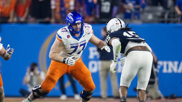 Dec 31, 2024; Glendale, AZ, USA; Boise State Broncos offensive tackle Kage Casey (77) against the Penn State Nittany Lions during the Fiesta Bowl at State Farm Stadium. Mandatory Credit: Mark J. Rebilas-Imagn Images