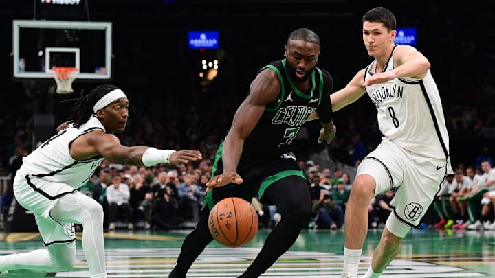 Nov 21, 2025; Boston, Massachusetts, USA; Boston Celtics guard Jaylen Brown (7) controls the ball between Brooklyn Nets guard Terance Mann (14) and guard Egor Demin (8) during the second half at TD Garden. Mandatory Credit: Bob DeChiara-Imagn Images Nov 21, 2025; Boston, Massachusetts, USA; Boston Celtics guard Jaylen Brown (7) controls the ball between Brooklyn Nets guard Terance Mann (14) and guard Egor Demin (8) during the second half at TD Garden. Mandatory Credit: Bob DeChiara-Imagn Images