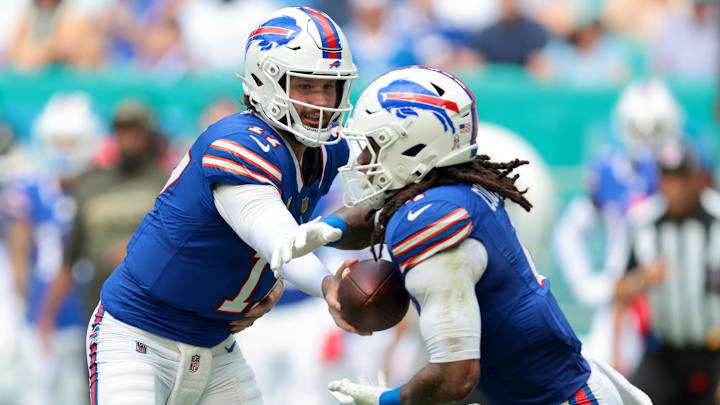 Buffalo Bills QB Josh Allen hands off to RB James Cook III during the first half against the Miami Dolphins.