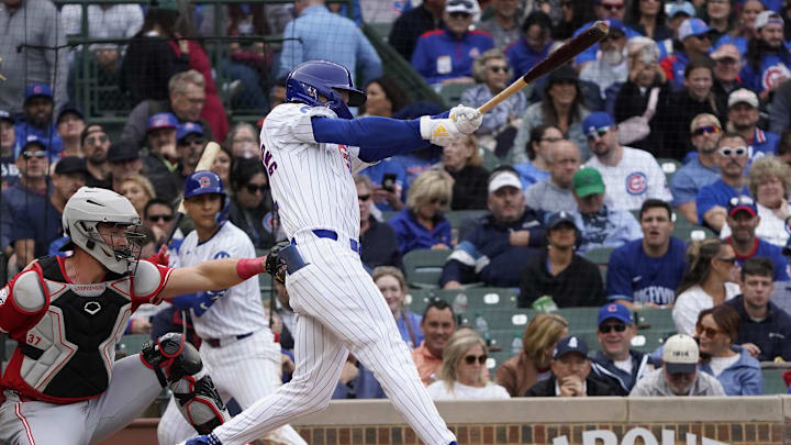 Sep 27, 2024; Chicago, Illinois, USA; Chicago Cubs outfielder Pete Crow-Armstrong (52) hits a single against the Cincinnati Reds during the eighth inning at Wrigley Field. 