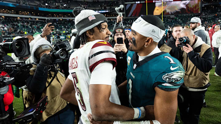 Nov 14, 2024; Philadelphia, Pennsylvania, USA; Philadelphia Eagles quarterback Jalen Hurts (1) and Washington Commanders quarterback Jayden Daniels (5) shake hands after an Eagles victory at Lincoln Financial Field. Mandatory Credit: Bill Streicher-Imagn Images
