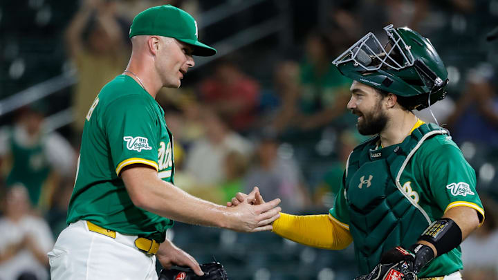 Aug 1, 2025; West Sacramento, California, USA; Athletics pitcher Sean Newcomb (31) shakes hands with pitcher Zac Gallen (23) after the game against the Arizona Diamondbacks at Sutter Health Park. Mandatory Credit: Sergio Estrada-Imagn Images