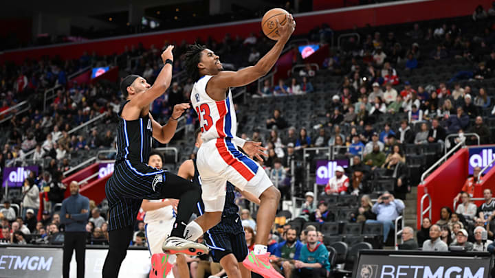Jan 1, 2025; Detroit, Michigan, USA; Detroit Pistons guard Jaden Ivey (23) drives past Orlando Magic guard Jalen Suggs (4) in the third quarter at Little Caesars Arena. Mandatory Credit: Lon Horwedel-Imagn Images Jan 1, 2025; Detroit, Michigan, USA; Detroit Pistons guard Jaden Ivey (23) drives past Orlando Magic guard Jalen Suggs (4) in the third quarter at Little Caesars Arena. Mandatory Credit: Lon Horwedel-Imagn Images