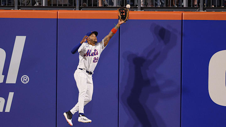 Apr 29, 2025; New York City, New York, USA; New York Mets left fielder Jose Azocar (28) leaps but can not catch a ball hit by Arizona Diamondbacks third baseman Eugenio Suarez (not pictured) during the eighth inning at Citi Field. Mandatory Credit: Vincent Carchietta-Imagn Images Apr 29, 2025; New York City, New York, USA; New York Mets left fielder Jose Azocar (28) leaps but can not catch a ball hit by Arizona Diamondbacks third baseman Eugenio Suarez (not pictured) during the eighth inning at Citi Field. Mandatory Credit: Vincent Carchietta-Imagn Images