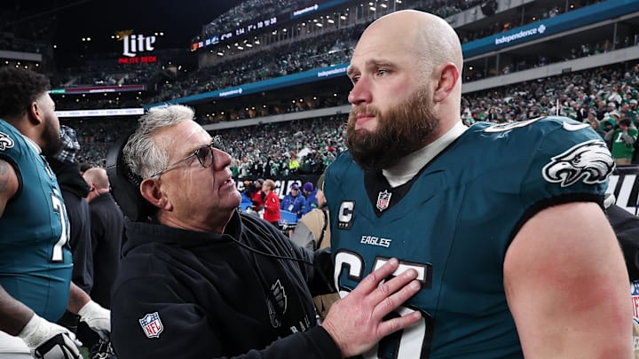 Jan 26, 2025; Philadelphia, PA, USA; Philadelphia Eagles assistant coach Jeff Stoutland (L) and offensive tackle Lane Johnson (65) in the final minute of a victory in the NFC Championship game against the Washington Commanders at Lincoln Financial Field. Mandatory Credit: Bill Streicher-Imagn Images