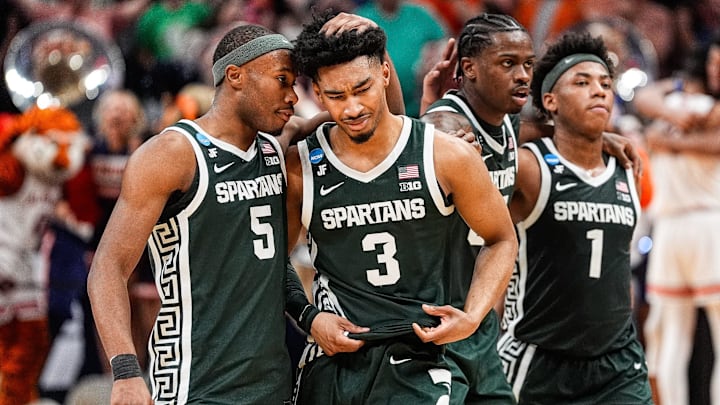 Michigan State guard Jaden Akins (3) is comforted by 
guard Tre Holloman (5) after 70-64 loss to Auburn at the Elite Eight round of NCAA tournament at State Farm Arena in Atlanta, Ga. on Sunday, March 30, 2025.