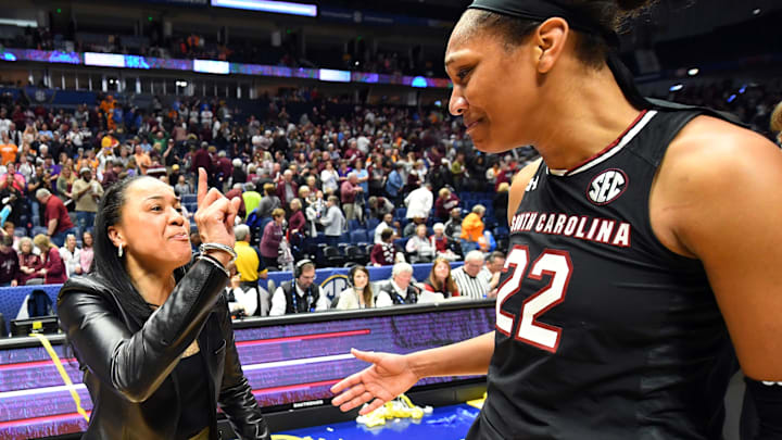 Mar 4, 2018; Nashville, TN, USA; South Carolina Gamecocks head coach Dawn Staley celebrates with forward A'ja Wilson (22) after a win over the Mississippi State Lady Bulldogs during the SEC Conference Tournament championship game at Bridgestone Arena. Mandatory Credit: Christopher Hanewinckel-Imagn Images