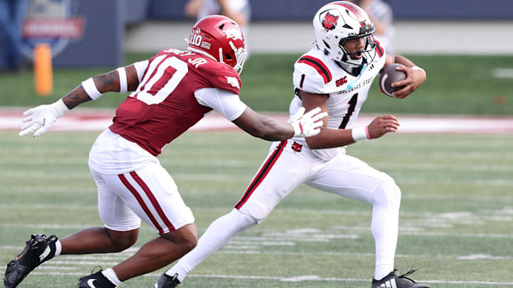 Sep 6, 2025; Little Rock, Arkansas, USA; Arkansas State Red Wolves quarterback Jaylen Raynor (1) rushes during the first quarter against the Arkansas Razorbacks at War Memorial Stadium.