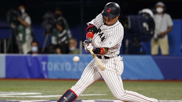 Aug 7, 2021; Yokohama, Japan; Team Japan infielder Munetaka Murakami (55) hits a solo home run against USA during the third inning in the baseball gold medal match during the Tokyo 2020 Olympic Summer Games at Yokohama Baseball Stadium. Mandatory Credit: Yukihito Taguchi-Imagn Images