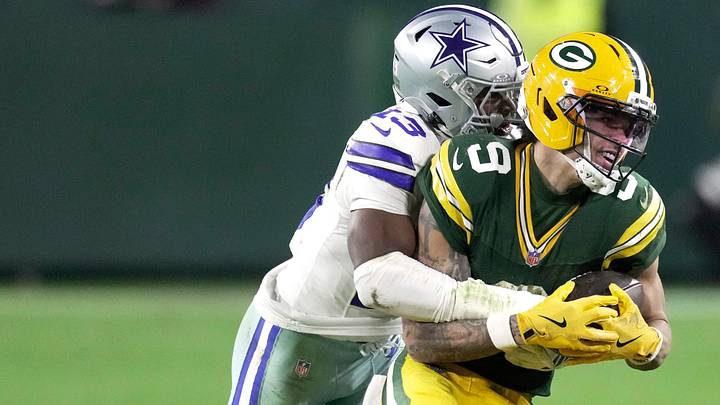 Green Bay Packers wide receiver Christian Watson (9) is tackled by Dallas Cowboys safety Caleb Downs (13) during the third quarter of their game Sunday, Oct. 18, 2026 at Lambeau Field in Green Bay, Wisconsin. Green Bay Packers wide receiver Christian Watson (9) is tackled by Dallas Cowboys safety Caleb Downs (13) during the third quarter of their game Sunday, Oct. 18, 2026 at Lambeau Field in Green Bay, Wisconsin.