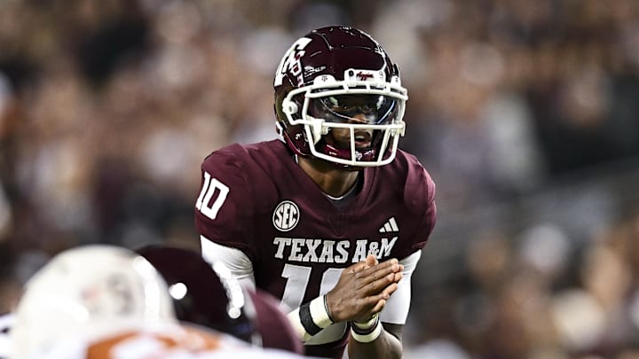 Nov 30, 2024; College Station, Texas, USA; Texas A&M Aggies quarterback Marcel Reed (10) calls a play during the first quarter against the Texas Longhorns. The Longhorns defeated the Aggies 17-7 at Kyle Field. Mandatory Credit: Maria Lysaker-Imagn Images  