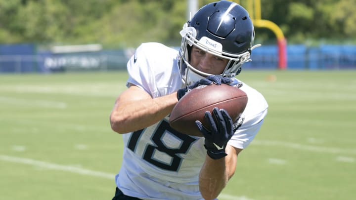 Aug 13, 2022; Nashville, Tennessee;  Tennessee Titans wide receiver Kyle Phillips (18) pulls in a catch during a training camp practice at Ascension Saint Thomas Sports Park.  Mandatory Credit: George Walker IV-Imagn Images