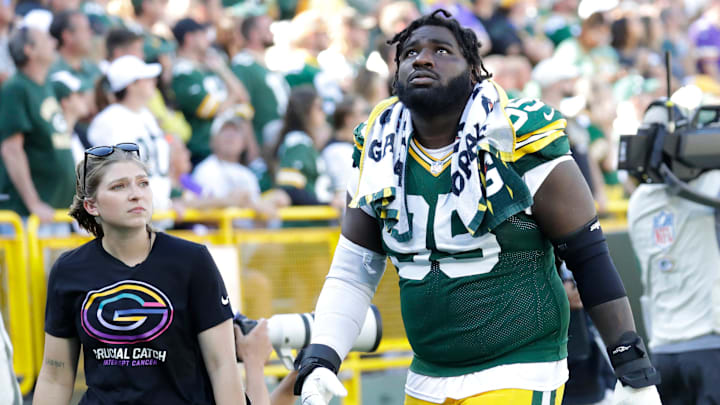 Green Bay Packers defensive tackle Devonte Wyatt (95) leaves the field in the fourth quarter during their football game against the Minnesota Vikings Sunday, September 29, 2024, at Lambeau Field in Green Bay, Wisconsin.
