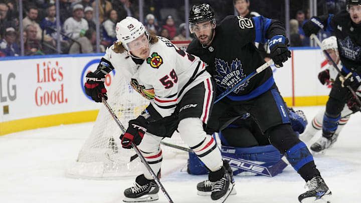 Dec 2, 2024; Toronto, Ontario, CAN; Chicago Blackhawks forward Tyler Bertuzzi (59) looks to pass the puck as Toronto Maple Leafs defenseman Conor Timmins (25) defends during the second period at Scotiabank Arena. Mandatory Credit: John E. Sokolowski-Imagn Images Dec 2, 2024; Toronto, Ontario, CAN; Chicago Blackhawks forward Tyler Bertuzzi (59) looks to pass the puck as Toronto Maple Leafs defenseman Conor Timmins (25) defends during the second period at Scotiabank Arena. Mandatory Credit: John E. Sokolowski-Imagn Images