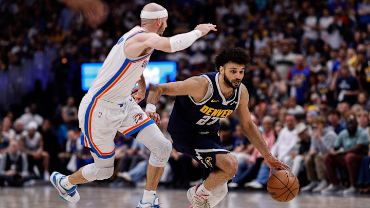 May 11, 2025; Denver, Colorado, USA; Denver Nuggets guard Jamal Murray (27) controls the ball under pressure from Oklahoma City Thunder guard Alex Caruso (9) in the third quarter during game four of the second round of the 2025 NBA Playoffs at Ball Arena. Mandatory Credit: Isaiah J. Downing-Imagn Images