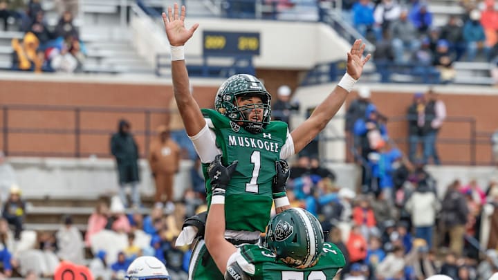 Muskogee's Jamarian Ficklin (1) celebrates a touchdown with Brady'n Henry (73) during the first half of the OSSAA 6AII State Football Championship Game Muskogee's Jamarian Ficklin (1) celebrates a touchdown with Brady'n Henry (73) during the first half of the OSSAA 6AII State Football Championship Game